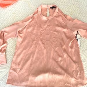 Soft pink top with cutout sleeve